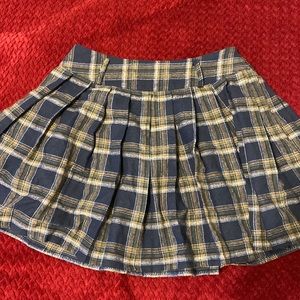 Pleated blue and yellow checkered skirt